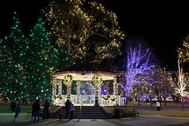 Night time photo of a gazebo, decorated and lit with Christmas lights.