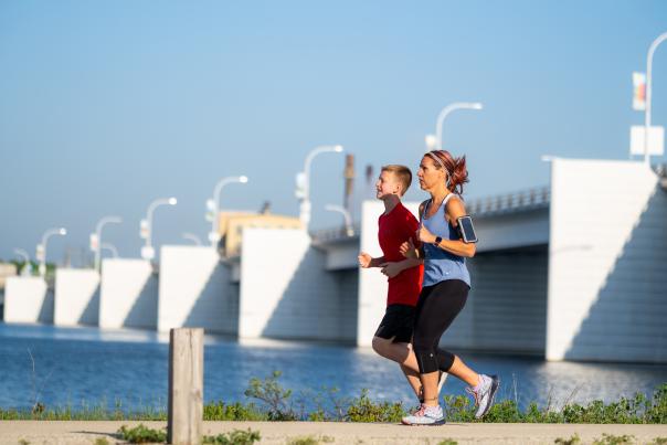 Mother and son running on Fox River Trail