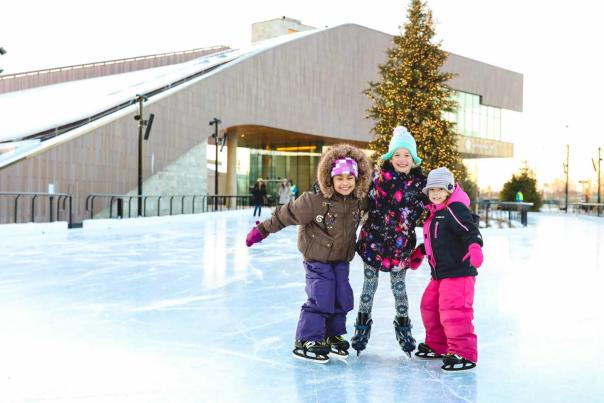 Kids gathered on the skating rink at titletown park
