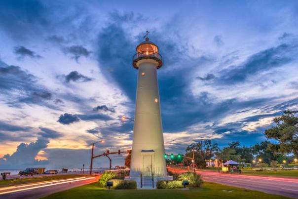 Biloxi lighthouse at twilight for MSN article: the one place to visit in every state this winter (2022)