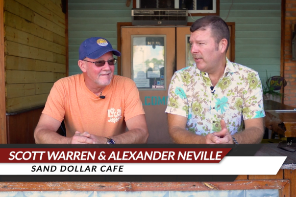 Alexander Neville & Scott Warren sitting in front of their local Gulf County Restaurant, Sand Dollar Cafe