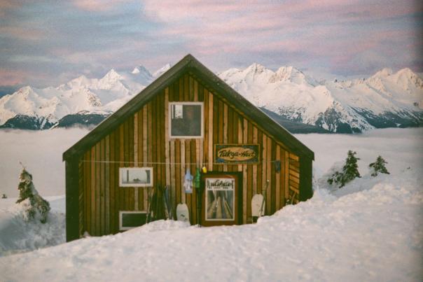 The Tukga Hut in the alpine backcountry near Haines, Alaska, built by Haines Huts & Trails volunteers who hauled materials 3,200 feet up the mountain over two years. Photo by Kayla Heidenreich.