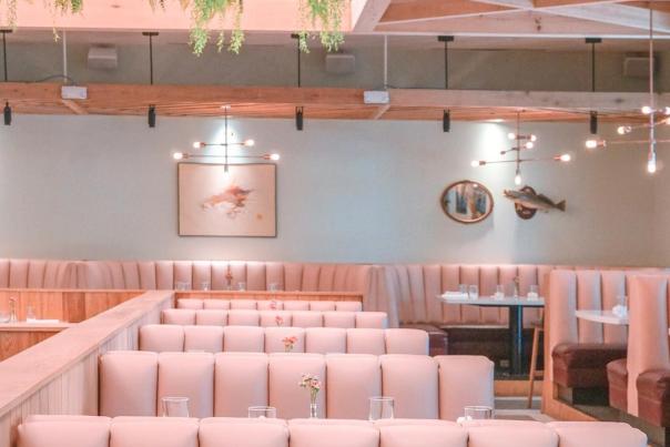 Pink seating booths inside the Indianola restaurant