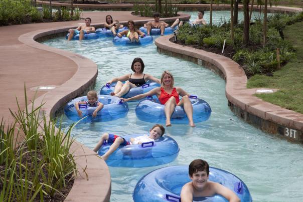 Kids In Inflatable tubes at the  Lazy river at The Woodlands Resort In Houston, TX