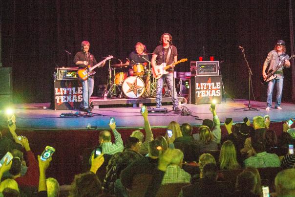 Little Texas Band performing on state in front of an audience in Conroe, Texas