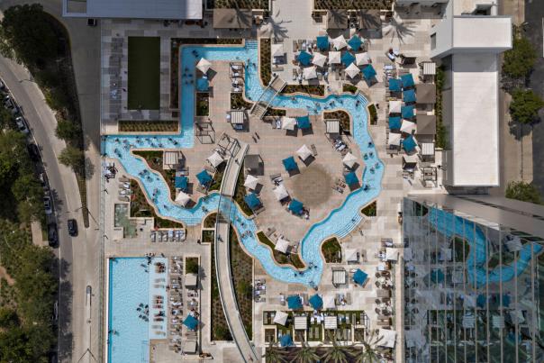 MMH Hotel features a pool and a lazy river in the outline of the state of Texas.