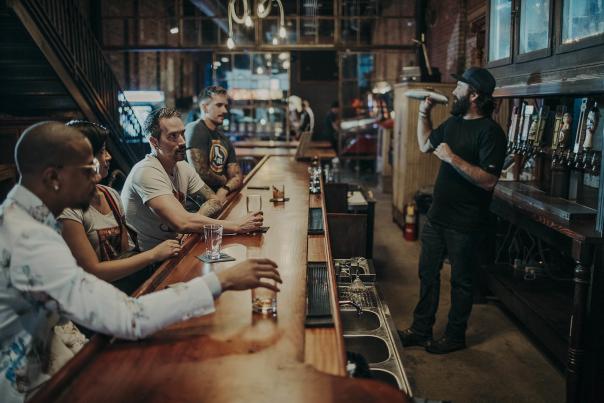 People sitting at the bar at Arcademie in Evansville, Indiana