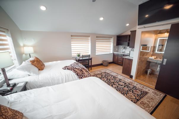 Interior of a hotel room with two beds at Iron Springs Resort in Cedar City, UT