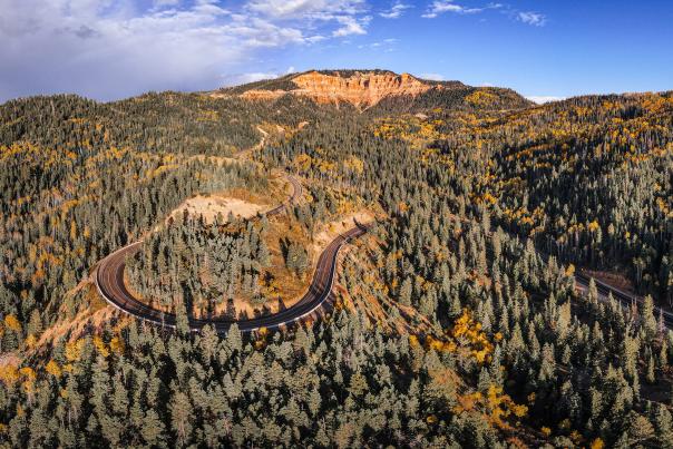Aerial views of the "False Breaks" in Cedar Canyon with fall color blended with towering pine trees along the scenic drive