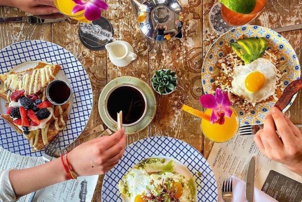 Visitors dive into a full brunch spread from Mexican Sugar in Irving, Texas.