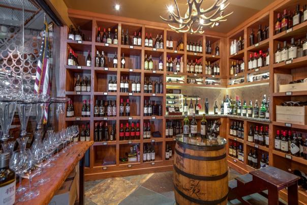 The wine cellar at The Ranch at Las Colinas features shelves full of wine of all vintages.