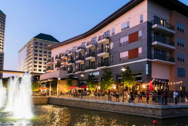 The patio seating area at Gingerman provides patrons with a relaxing waterfront atmosphere In Irving, TX