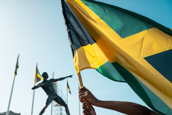 Jamaica Flag Celebration at National Stadium Bolt Statue