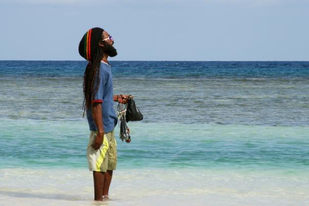Jamaican man overlooking the sea