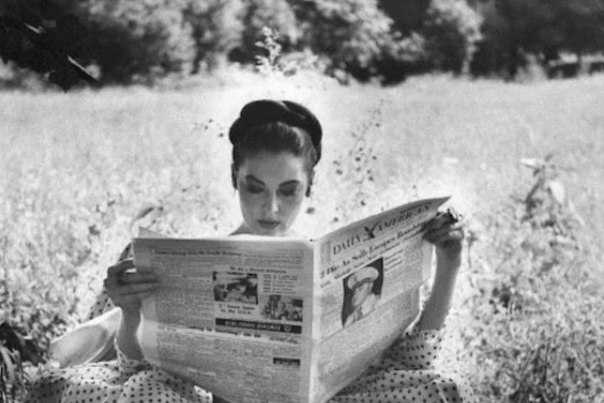 Ava Reading Newspaper