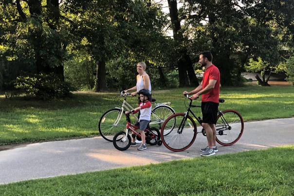 Family riding on the Mountains to the Sea trail in Smithfield, NC.