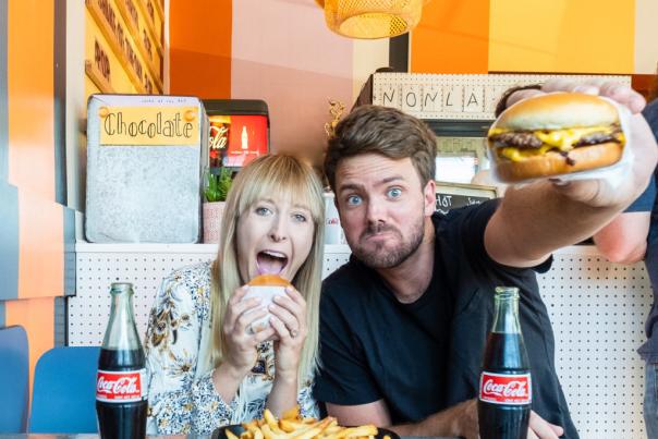 Couple eating burgers