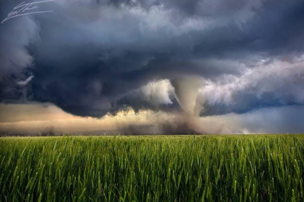 A tornado moving across a grassy plain in Dodge City, KS