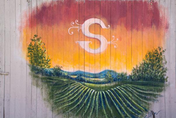Mural of a vineyard at sunset in the Shiloh winery