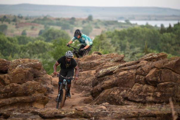 mountain bike riding over rocks