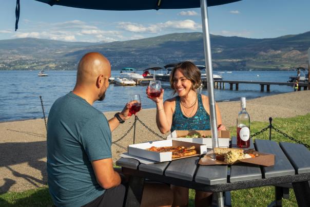 Couple with wine and food at Frind Winery picnic area