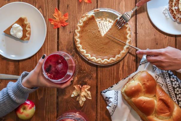 Pumpkin pie on a Thanksgiving inspired wood table