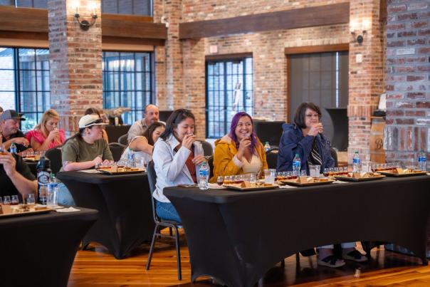 attendees sip rum samples at during the bayou rum master class for the louisiana food and wine festival