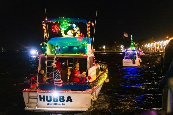 boats lit with Christmas lights in Lake Charles