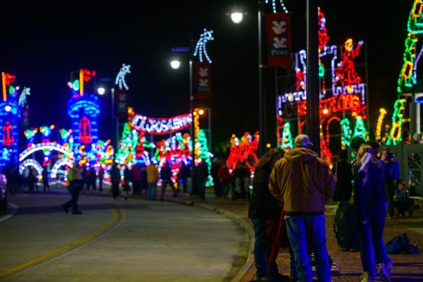 red, blue, yellow, green, and white Christmas light displays along downtown lake charles