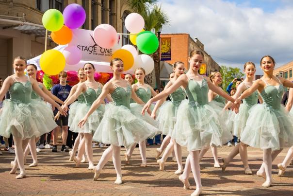 ballerinas in green costumes dance in downtown lake charles