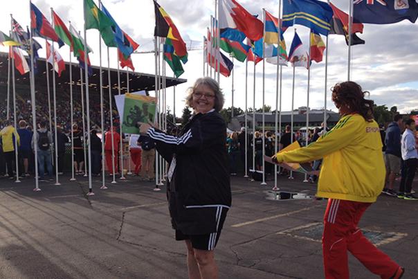 Juanita in front of the country flags at IAAF Juniors in Eugene, OR