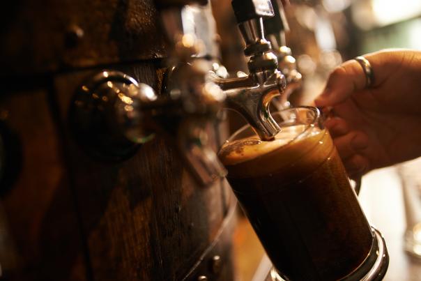 Beer being poured into a stein.