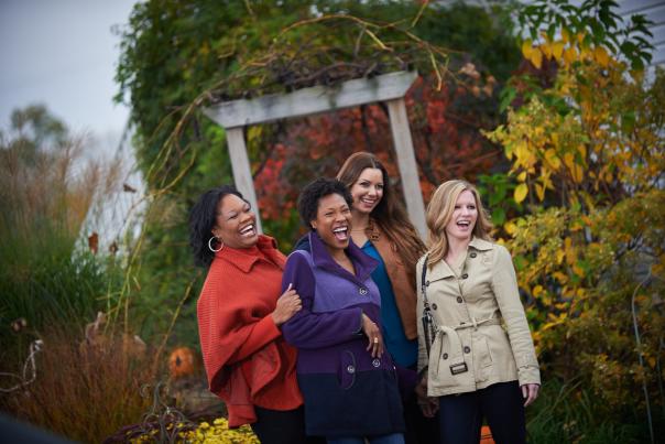 Four women laughing