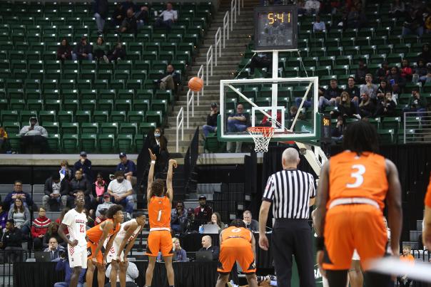 Basketball players shooting the ball