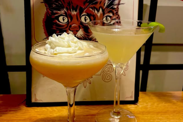 Two cocktails in martini glasses at American Fifth Spirits.