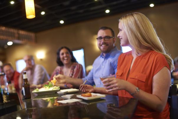 A group of people sitting at a table