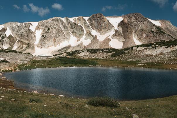 Alpine Lake snowy mountain behind