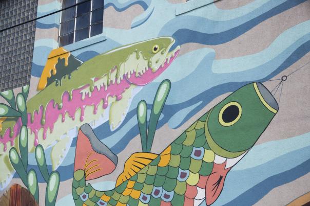 Mural of fantasy fish including a kite and paint fish.