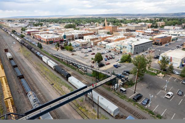 Trains rumble below the Garfield Street Footbridge in Downtown Laramie