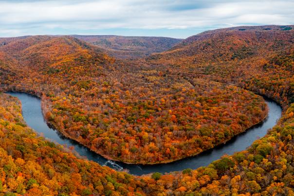 The Youghiogheny River in Ohiopyle State Park is shown surrounded by brilliant fall colors.