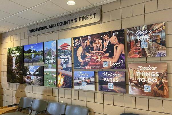 Handy Resource Wall with scannable QR codes at Arnold Palmer Regional Airport