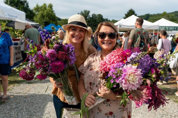 Ligonier Farmer's Market - two ladies holding flowers