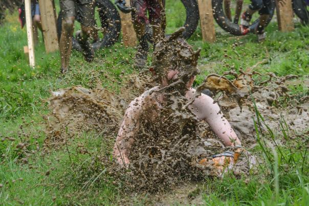A Kids’ Mud on the Mountain participant makes a big splash during the competition