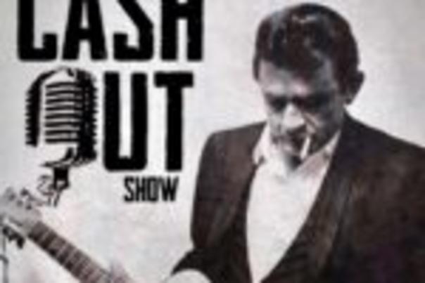 Johnny Cash holding a guitar.