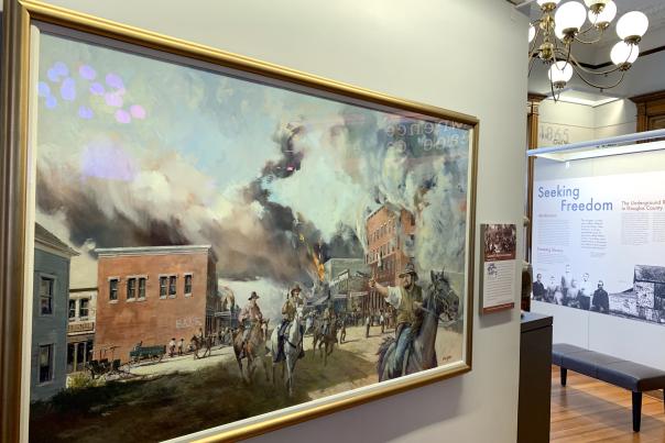 Quantrill's Raid painting at Watkins Museum of History