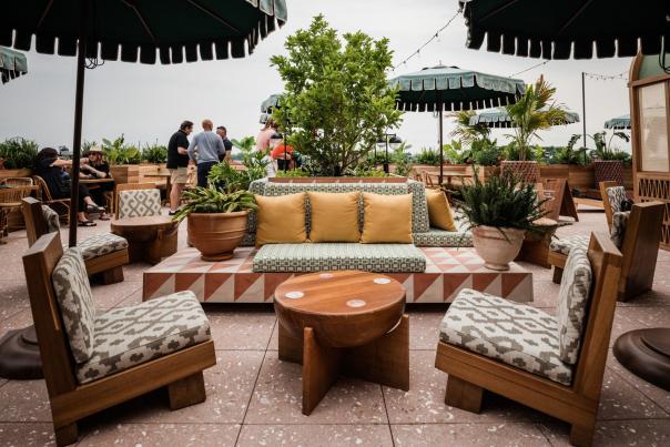 Rooftop patio with decorative furniture and umbrellas