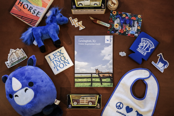 Table with various blue horse and Lexington merch items