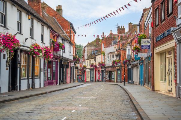 A view down the Bailgate, a historic street lined with colourful shops