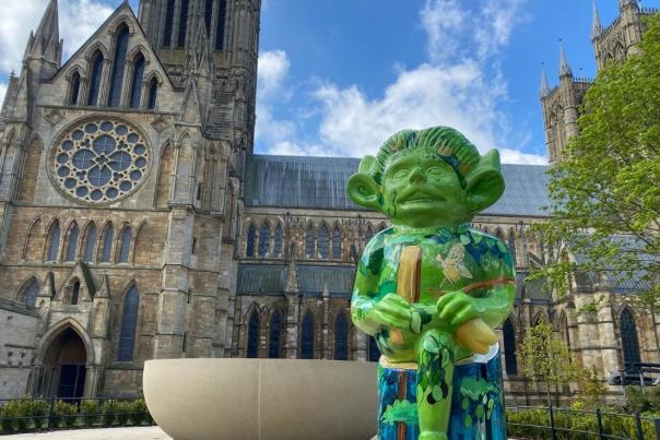 statue of the green imp outside Lincoln Cathedral