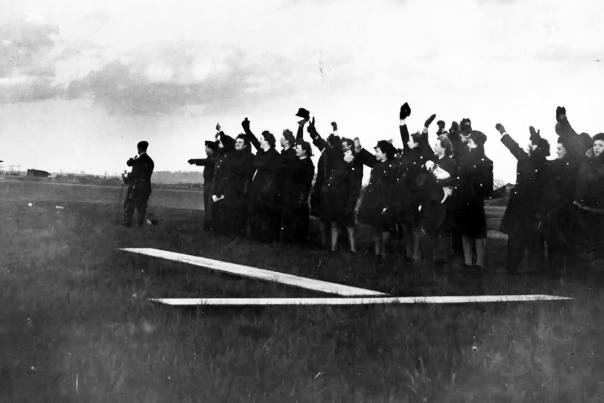 Image shows a group waving.